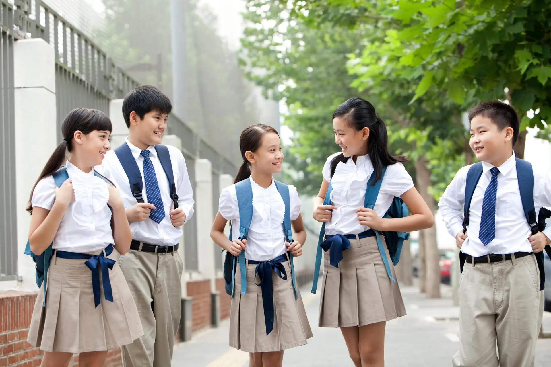 lovely-schoolchildren-in-uniform-on-the-way-to-sch-2024-10-18-06-42-18-utc